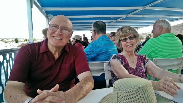 October 2015 Laughlin Reunion — couple smiling on boat deck with river view behind them