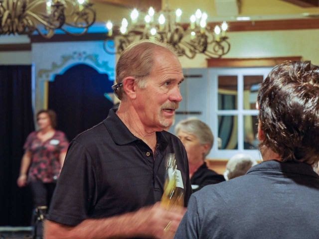 October 2016 Laughlin Picnic — man in black polo chatting at event