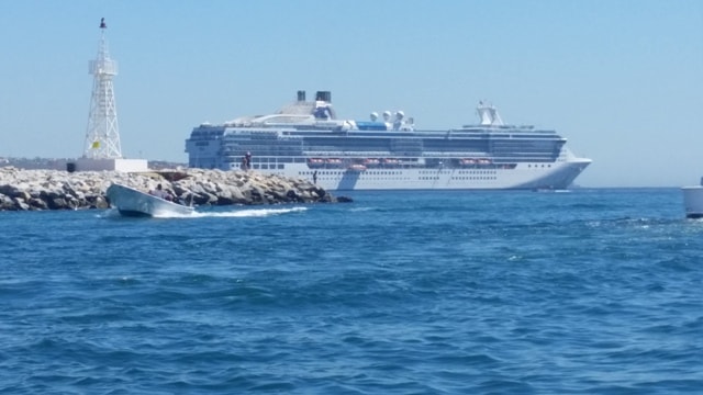February 2017 Cruise — cruise ship departing harbor with lighthouse