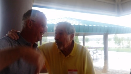 August 2018 Picnic — two men chatting under pavilion