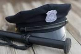Police cap and flashlight